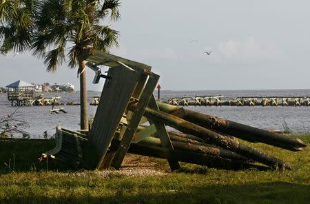 A section of the pier lies washed up on land after rain and wind from Hurricane Hermine hit the town of Keaton Beach, Florida, U.S. September 2, 2016. REUTERS/Phil Sears