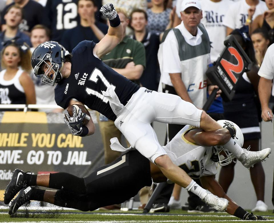 Rice receiver Zach Wright (17) is tackled by Baylor defensive back Patrick Levels. (AP Photo/Eric Christian Smith)