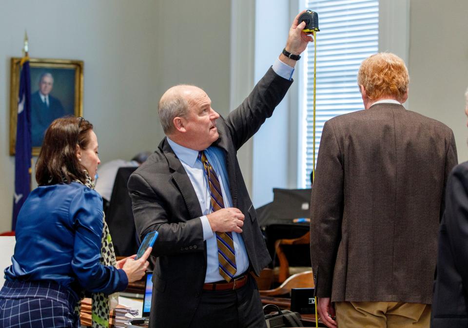 Defense attorney Jim Griffin measures his client Alex Murdaugh during the lunch break at his trial at the Colleton County Courthouse in Walterboro, Thursday, Feb. 16, 2023. Grace Beahm Alford/The Post and Courier/Pool