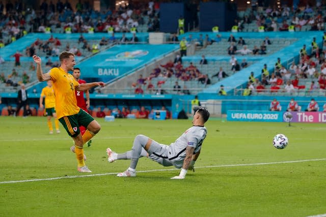 Aaron Ramsey slots home the opening goal 