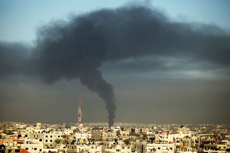 Smoke billows from Israeli bombardment over Khan Younis in the southern Gaza Strip on Monday. Photo by Ismael Mohamad/UPI