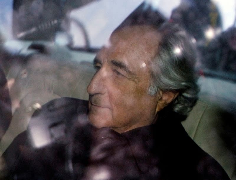 FILE PHOTO: Bernard Madoff is escorted from Federal Court in New York