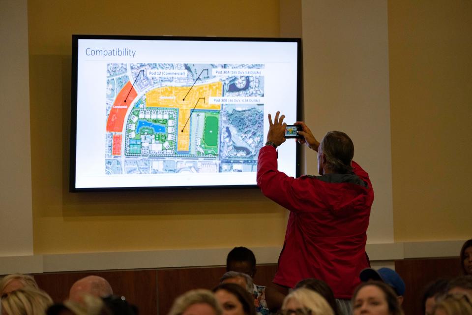 A slide from the Wellington North proposal to build new luxury homes and expand the equestrian showgrounds is projected on a screen during the Wellington's Equestrian Preserve Committee meeting on June 7, 2023 in Wellington, Florida. The committee denied the proposal.