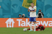 Russia's Artem Dzyuba reacts during the Euro 2020 soccer championship group B match between Belgium and Russia at the Saint Petersburg stadium in St. Petersburg, Russia, Saturday, June 12, 2021. (Anatoly Maltsev/Pool via AP)