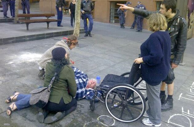 Woman falls from her wheelchair at the Occupy Sydney protest camp. An ambulance is called for her. Photo: @robertovadia