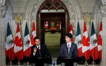 Mexico's President Enrique Pena Nieto (L) speaks during a news conference with Canada's Prime Minister Justin Trudeau on Parliament Hill in Ottawa, Ontario, Canada, June 28, 2016. REUTERS/Chris Wattie