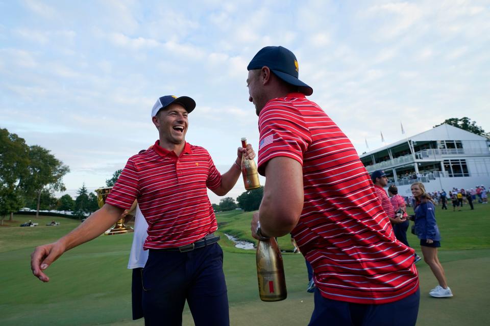 Jordan Spieth, left, and Justin Thomas celebrate after a team win in match play against the International team at the Presidents Cup golf tournament at the Quail Hollow Club on Sept. 25, 2022, in Charlotte, N.C.