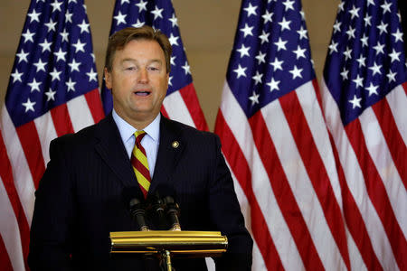 FILE PHOTO: Sen. Dean Heller (R-NV) speaks during a ceremony to present the Congressional Gold Medal to Filipino veterans of the Second World War on Capitol Hill in Washington, U.S., October 25, 2017. REUTERS/Aaron P. Bernstein/File Photo