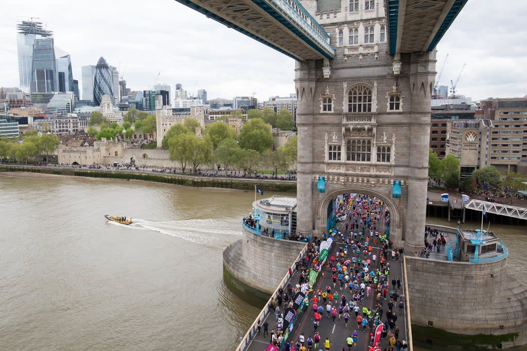 Runners cross Tower Bridge during the 2019 Virgin Money London Marathon (PA) (PA Archive)