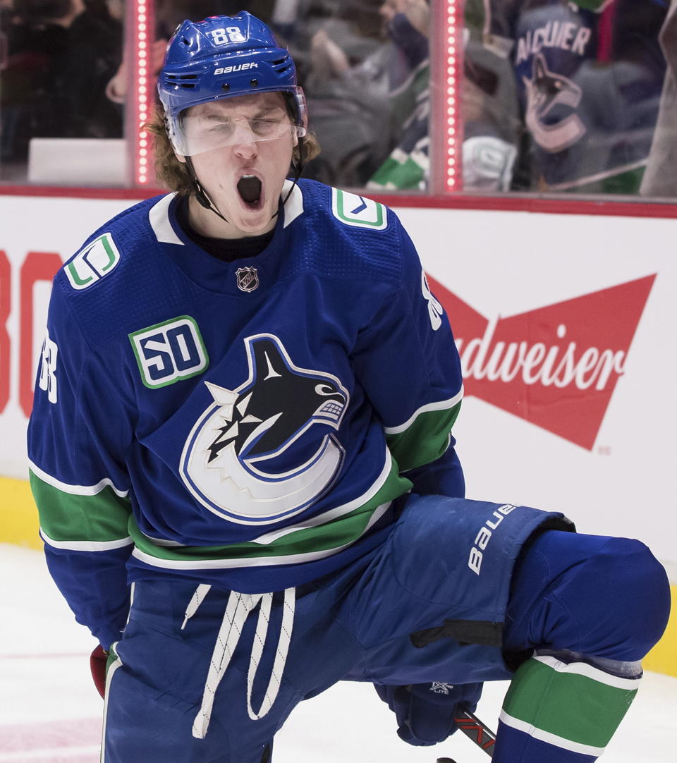 Vancouver Canucks' Adam Gaudette celebrates his goal against the Chicago Blackhawks during the second period of an NHL hockey game Wednesday, Feb. 12, 2020, in Vancouver, British Columbia. (Darryl Dyck/The Canadian Press via AP)