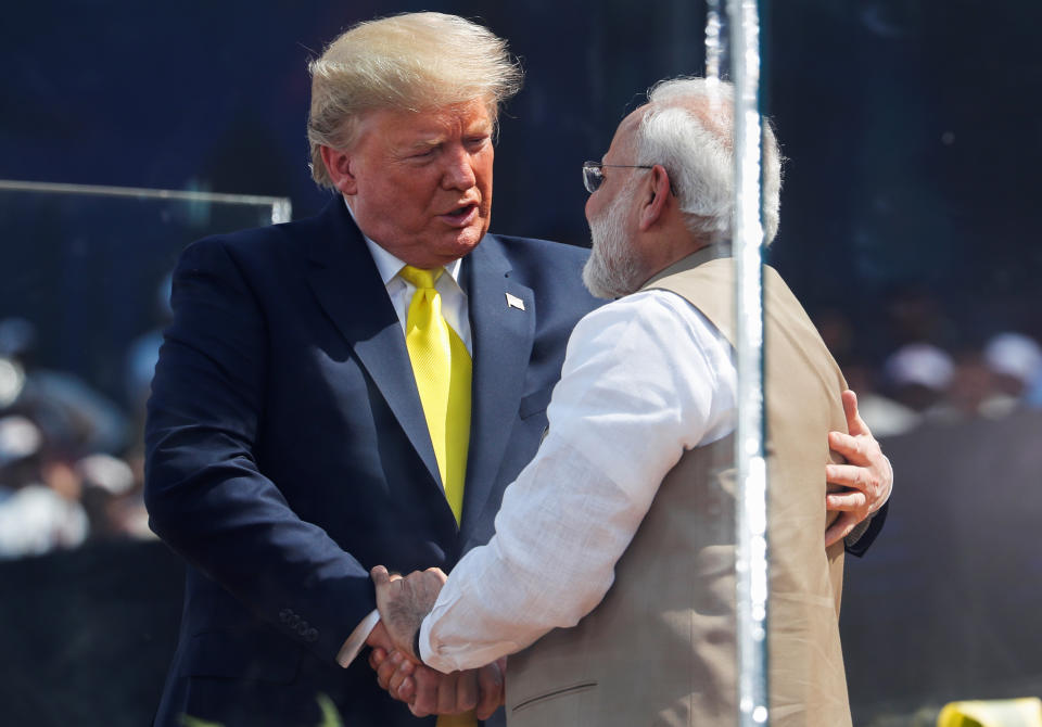 U.S. President Donald Trump embraces with Indian Prime Minister Narendra Modi during the "Namaste Trump" event at Sardar Patel Gujarat Stadium, in Ahmedabad, India, February 24, 2020. REUTERS/Al Drago