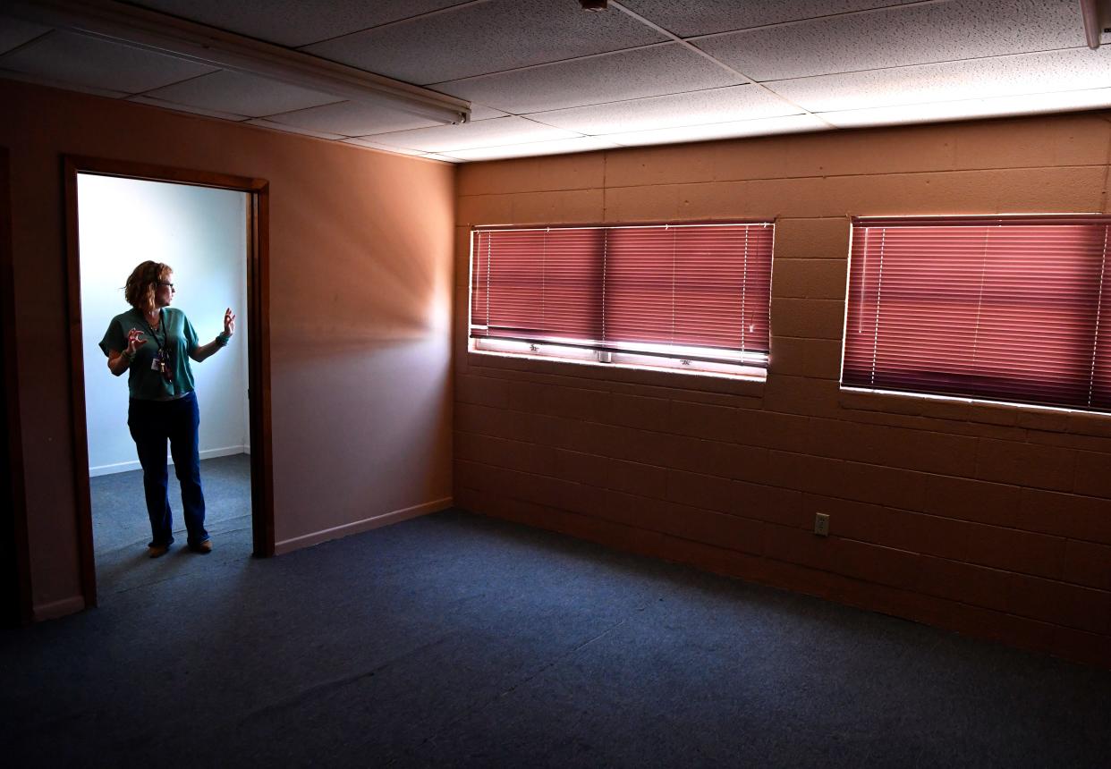 Abilene Salvation Army Director of Development Jill Morrison walks through one of the rooms of a building that soon will become more office space. The new building is located directly across Butternut Street from her facility.
