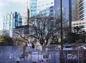 Media trucks set up as preparations continue for the murder trial of former Minneapolis police officer Derek Chauvin which begins Monday and was seen near the Hennepin County Government Center Thursday, March 4, 2021 in Minneapolis. (David Joles/Star Tribune via AP)