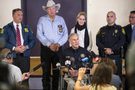 <p>Texas Gov. Greg Abbott, seated right, addresses members of the media about the mass shooting at the First Baptist Church in Sutherland Springs, Texas, during a press conference in Stockdale, Texas, on Nov. 5, 2017. (Nick Wagner/Austin American-Statesman via AP) </p>