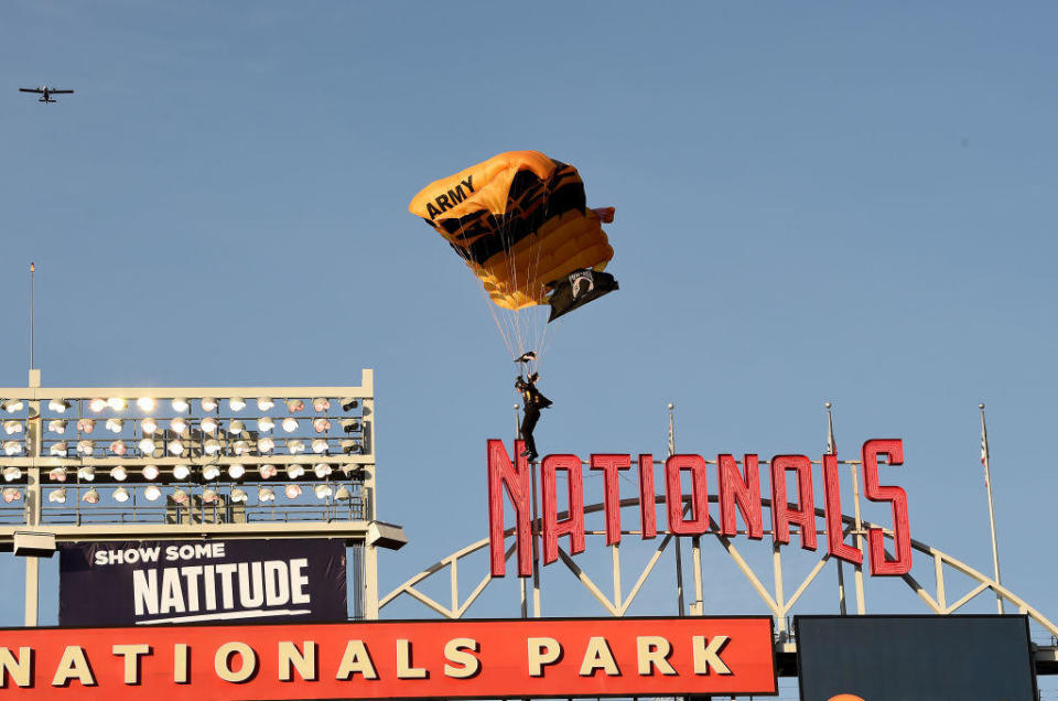 A member of the U.S. Army Parachute Team The Golden Knights lands at Nationals Park before the game between the Washington Nationals and the Arizona Diamondbacks on April 20, 2022 in Washington, D.C. / Credit: Getty Images