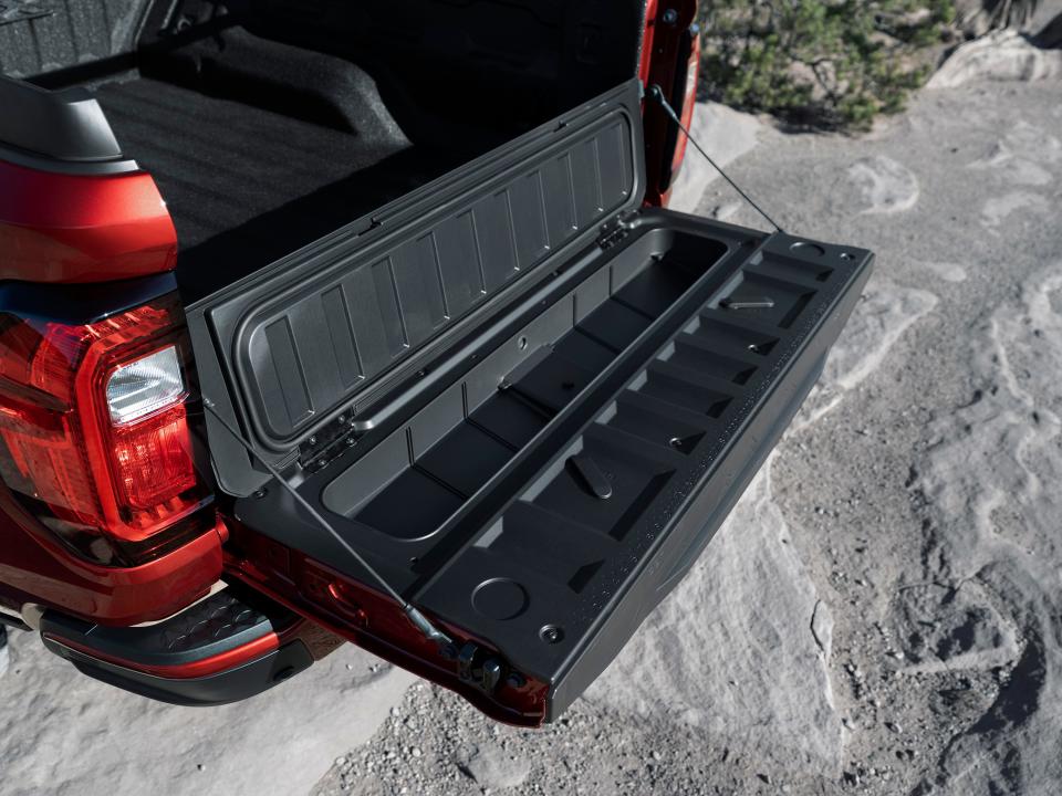 The 2023 GMC Canyon AT4X Edition 1 midsize pickup's tailgate has a secure storage comartment.