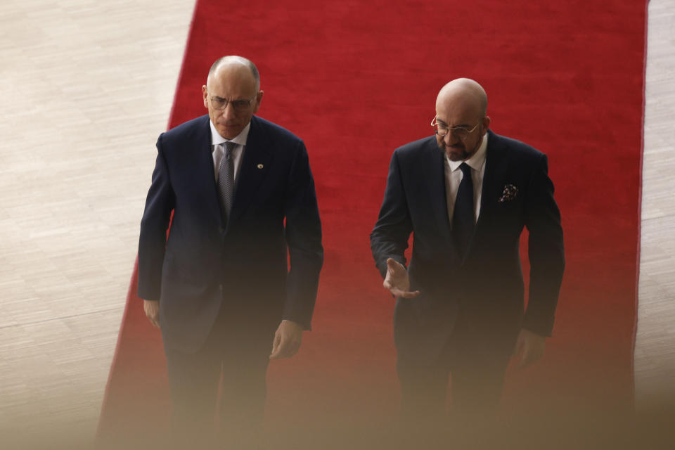 European Council President Charles Michel, right, speaks with author of the High-Level Report on the future of the Single Market, Enrico Letta, as they arrive for an EU summit in Brussels, Thursday, April 18, 2024. European Union leaders vowed on Wednesday to ramp up sanctions against Iran as concern grows that Tehran's unprecedented attack on Israel could fuel a wider war in the Middle East. (AP Photo/Omar Havana)