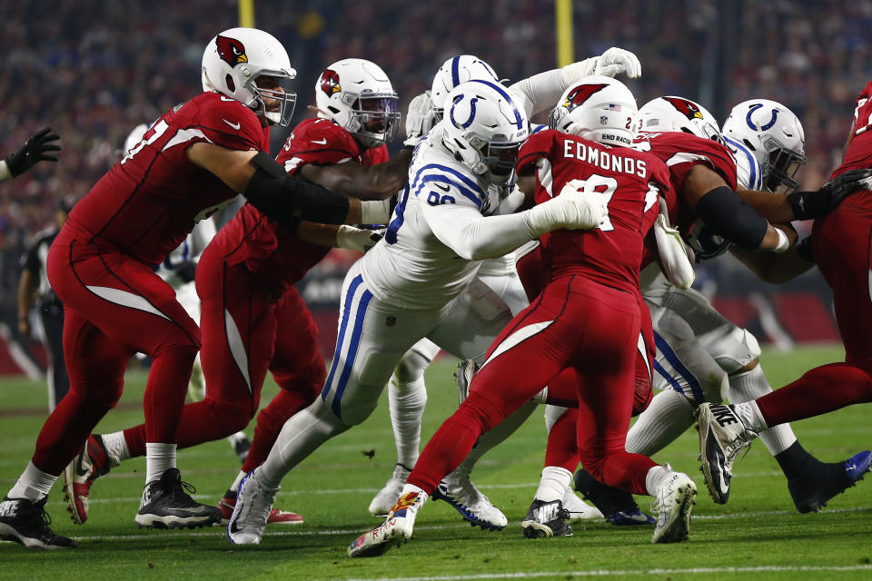 GLENDALE, AZ - DECEMBER 25: Indianapolis Colts Defensive Tackle DeForest Buckner (99) hits Arizona Cardinals Running Back Chase Edmonds (2) in the back field during an NFL game between the Indianapolis Colts and the Arizona Cardinals on December 25, 2021 at State Farm Stadium, in Glendale AZ. (Photo by Jeffrey Brown/Icon Sportswire via Getty Images)