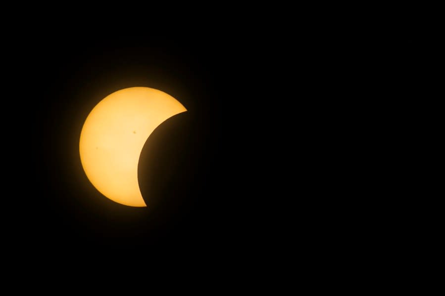 The moon begins to eclipse the sun during the total solar eclipse in Mazatlan, Sinaloa state, Mexico on April 8, 2024. (Photo by RASHIDE FRIAS/AFP via Getty Images)