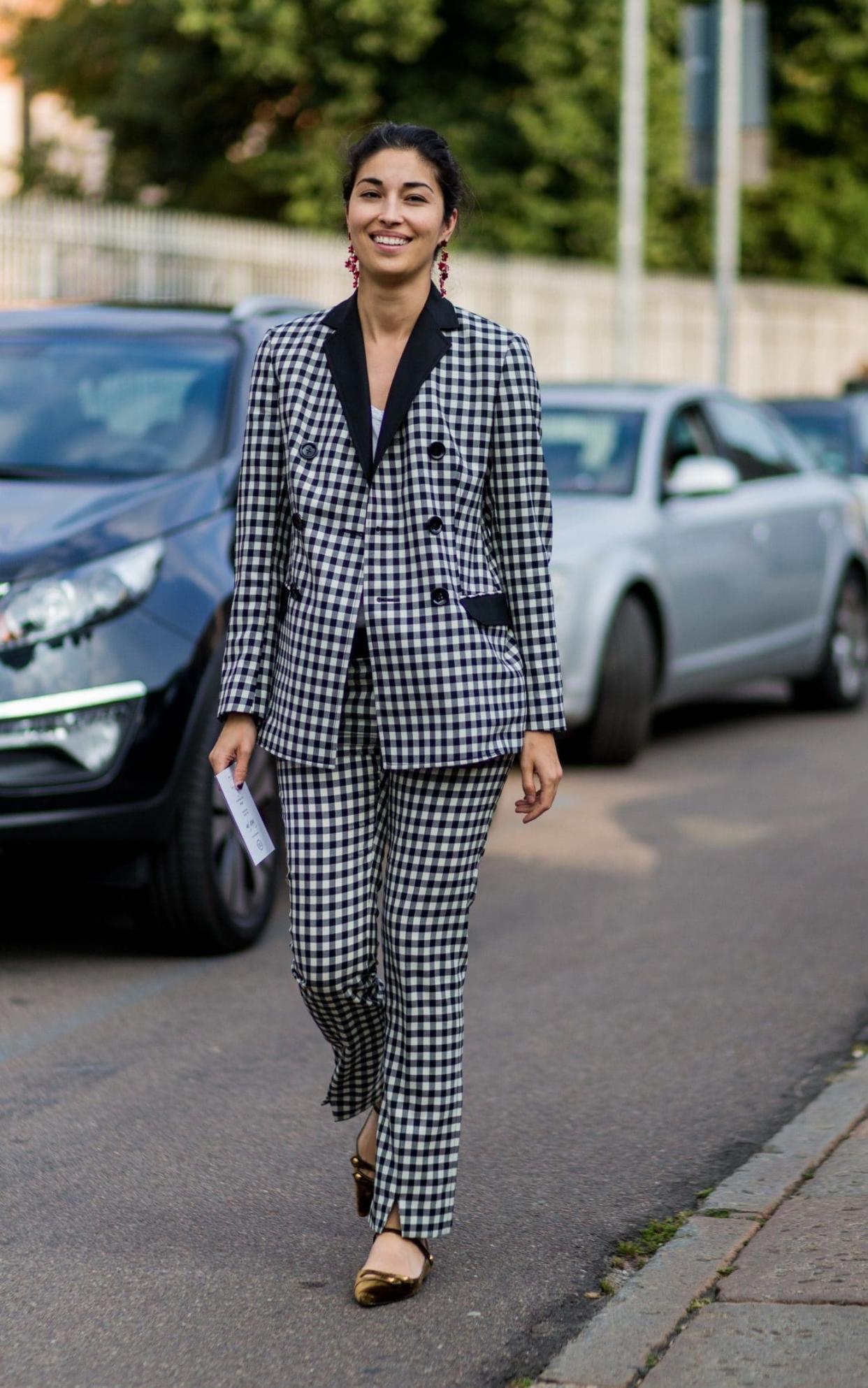 Caroline Issa accessorises check tailoring with velvet flats and shoulder-grazing earrings - Getty Images Europe