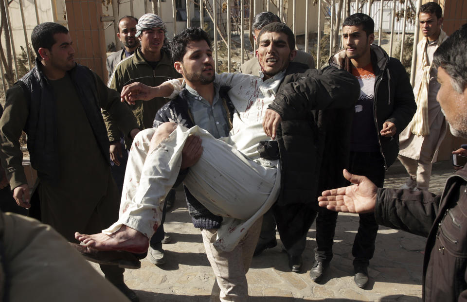 <p>Afghan Injured men receives a treatment at a hospital after a suicide attack in Kabul, Afghanistan, Saturday Jan. 27, 2018. (Photo: Rahmat Gul/AP) </p>