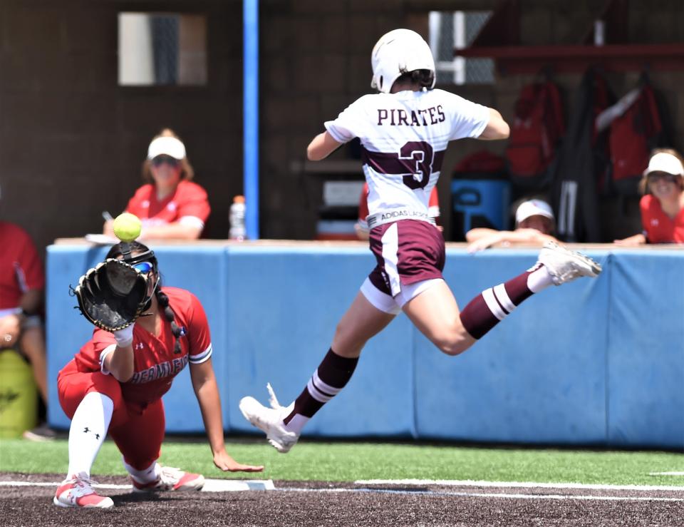 Hermleigh first baseman Hailey Minton, left, fields the throw as Eula's Madison Stawarczik (3) tries to beat out a ground ball to third in the fifth inning. She was out to end the inning.