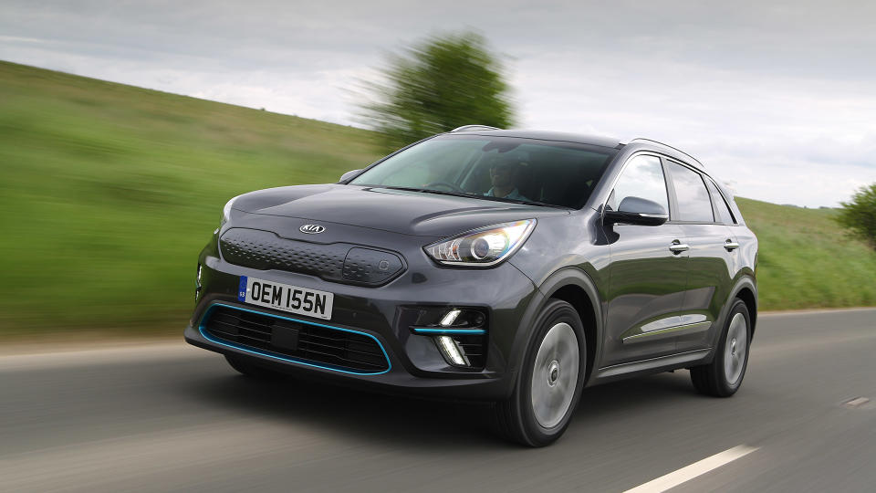 Kia e-Niro in black driving on a road