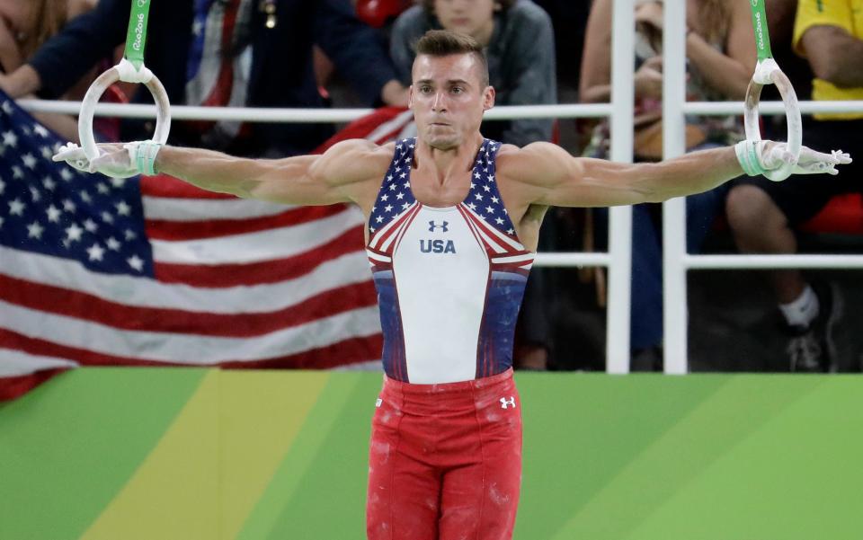 United States' Sam Mikulak performs on the rings during the artistic gymnastics men's qualification at the 2016 Summer Olympics in Rio de Janeiro, Brazil, Saturday, Aug. 6, 2016. (AP Photo/Dmitri Lovetsky)