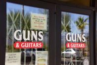 <p>The entrance to Guns & Guitars store is seen in Mesquite, Nev., Oct. 3, 2017. Stephen Paddock, who had purchased fire arms at Guns & Guitars, killed dozens and injured hundreds when he opened fire on a country music concert in Las Vegas, Nevada, Oct. 1, 2017. (Photo: Robyn Beck/AFP/Getty Images) </p>