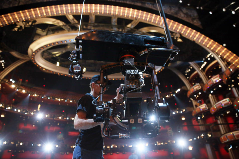 A member of the crew checks a camera onstage during rehearsals for the 86th Academy Awards in Los Angeles, Saturday, March 1, 2014. The Academy Awards will be held at the Dolby Theatre on Sunday, March 2. (Photo by Matt Sayles/Invision/AP)