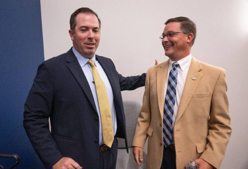 New UC Davis football coach Tim Plough talks with Athletic Director Rocko DeLuca on Monday, Dec. 4, 2023, before Plough’s official introduction as the Aggies’ new head football coach.