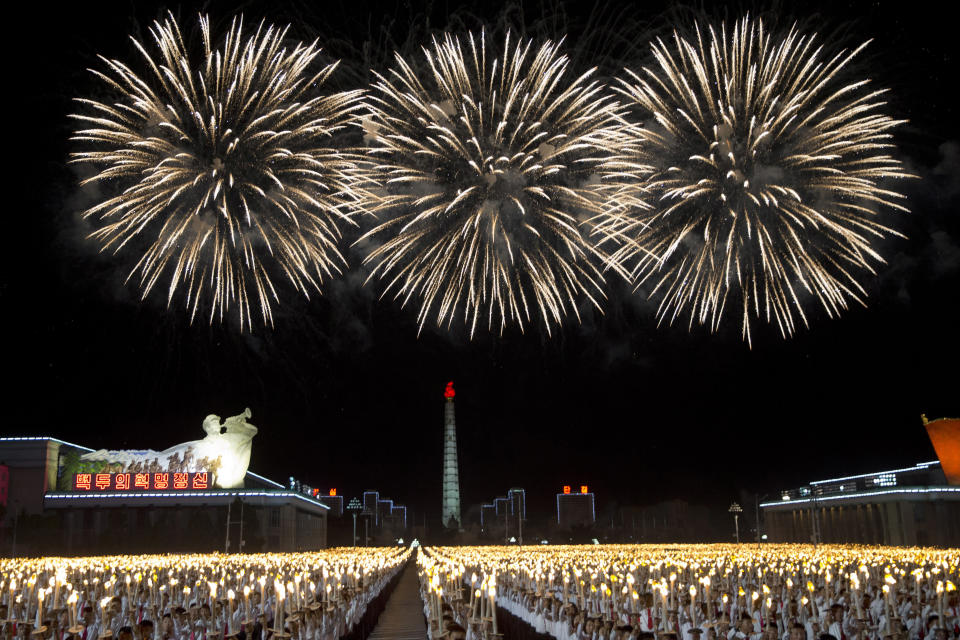 North Korean students take part in a torch light march held in conjunction with the 70th anniversary of North Korea's founding day celebrations in Pyongyang, North Korea, Monday, Sept. 10, 2018. (AP Photo/Ng Han Guan)