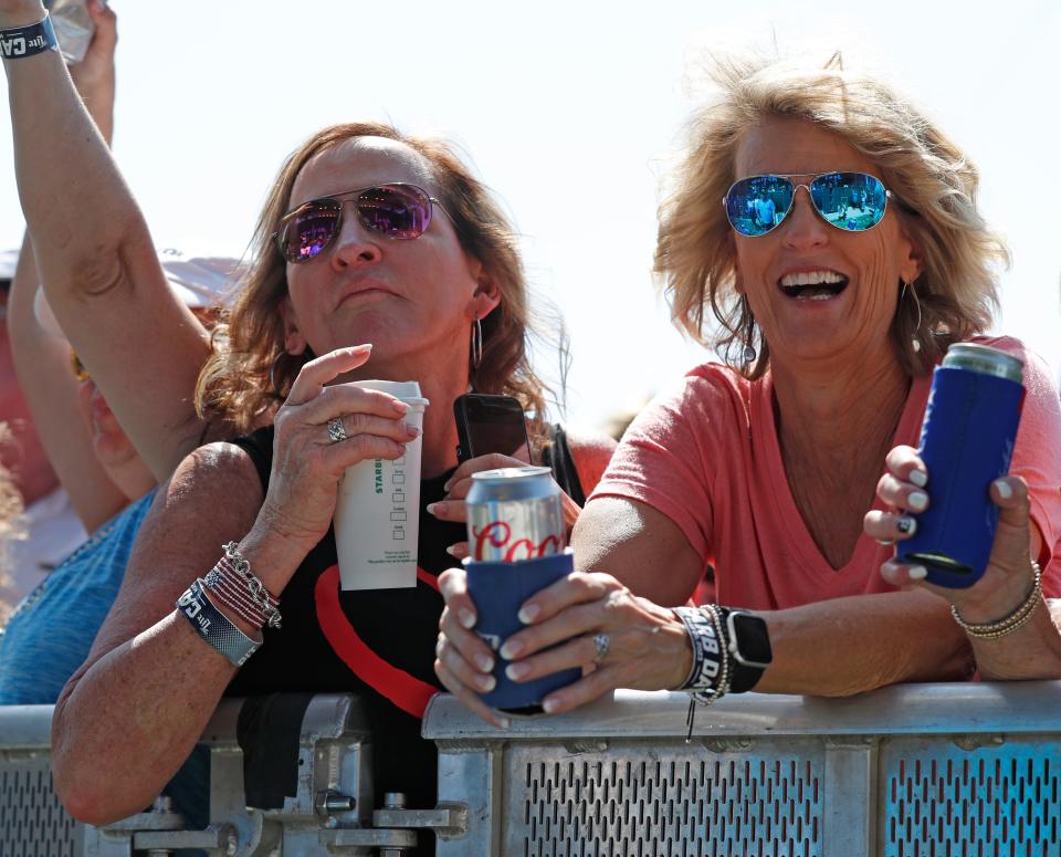 Spectators watch Soul Asylum perform, Friday, May 26, 2023, during Carb Day ahead of the 107th running of the Indianapolis 500 at Indianapolis Motor Speedway.