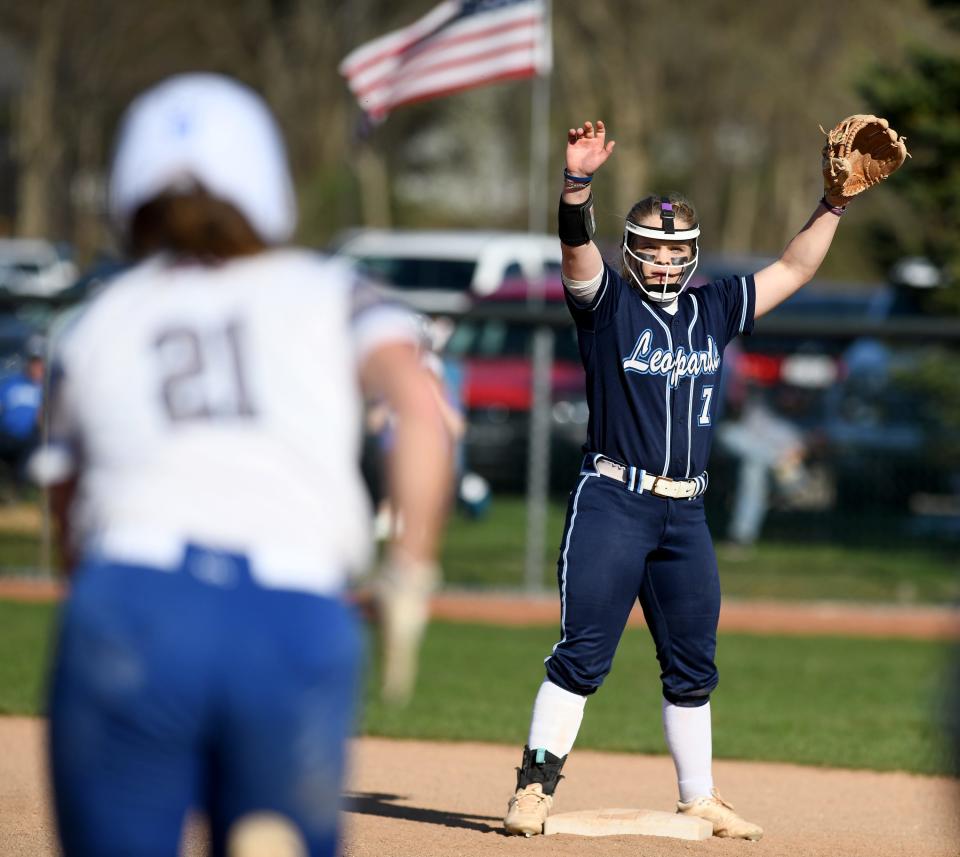 Louisville's Matti Benson waves down the ball in the second inning of Lake at Louisville softball.  Thursday, April 13, 2023.