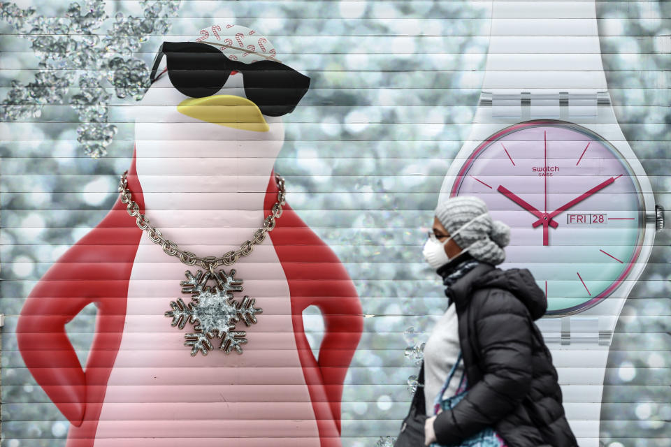 ISTANBUL, TURKEY - APRIL 02: A woman wearing a medical mask at nearly empty Istiklal street as coronavirus (Covid-19) pandemic precautions are taken in Istanbul, Turkey on April 02, 2020. (Photo by Serhat Cagdas/Anadolu Agency via Getty Images)