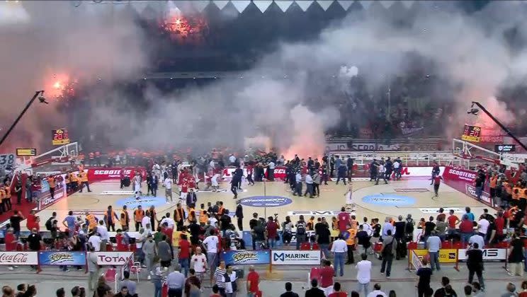 Olympiakos fans set Peace and Friendship Stadium ablaze at the end of a loss to Panathinaikos. (@EneaTrapani on Twitter)