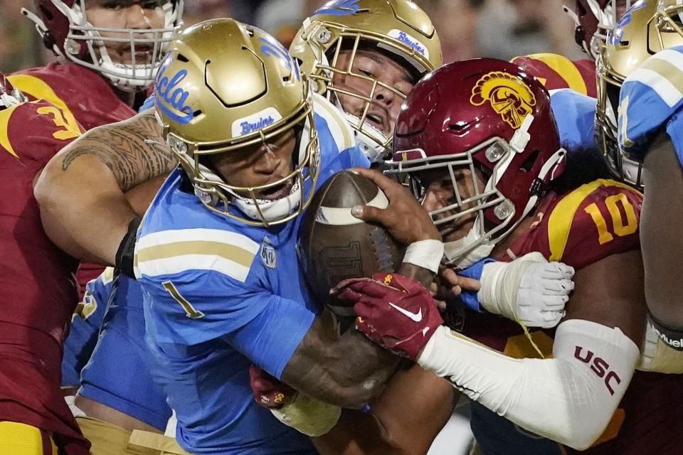 UCLA quarterback Dorian Thompson-Robinson (1) heads in for a touchdown against USC, Nov. 19, 2022, in Pasadena, Calif.