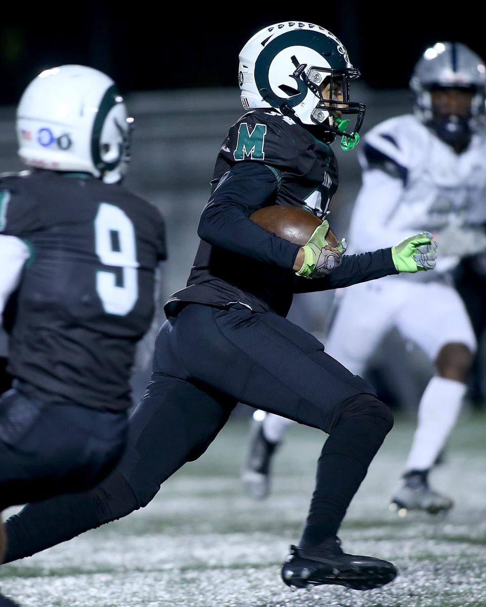 Marshfield's Giovanni Joseph explodes upfield for a big return during first quarter action of their game in the Sweet 16 round of the Division 2 state tournament at Marshfield High on Friday, Nov. 3, 2023. Marshfield would go on to win 55-34.