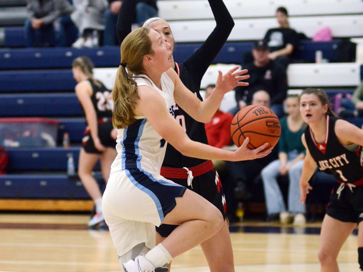 Petoskey guard Kenzie Bromley drives to the basket and finishes during the second quarter against Lake City on Saturday.