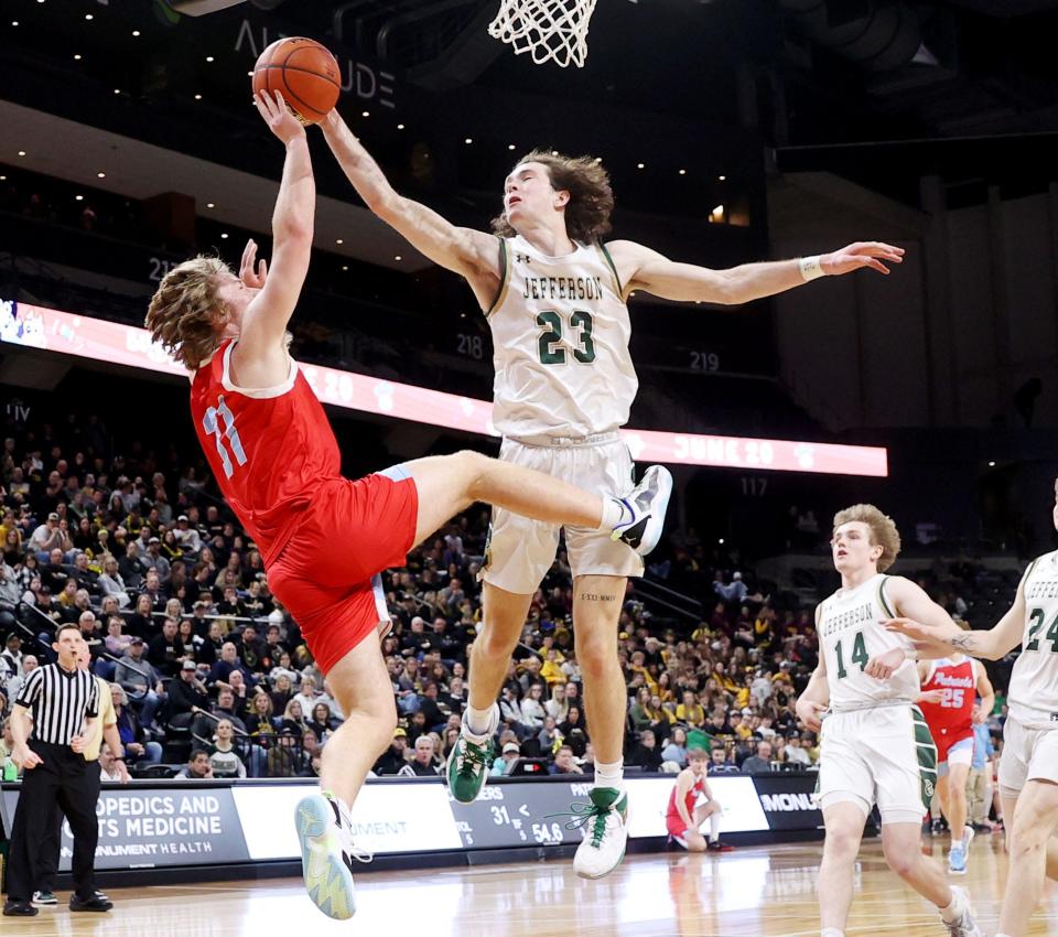 Sioux Falls Jefferson's Kaden Year blocks a shot by Sioux Falls Lincoln's Elliot Whitney during the third-place game of the state Class AA boys basketball tournament on Saturday, March 18, 2023 in The Monument at Rapid City.