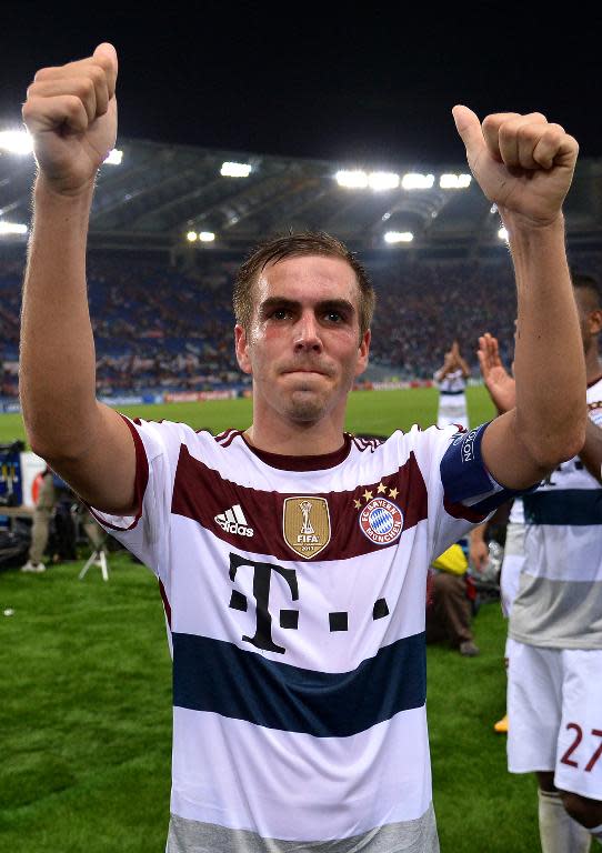 Bayern Munich's Philipp Lahm celebrates his German side's 1-7 defeat over Roma in their Champions League group clash on October 21, 2014 at the Olympic stadium in Rome