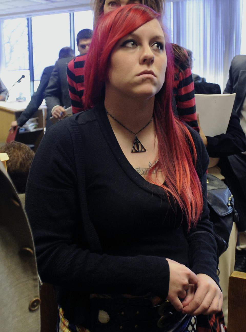 Steve Utash's daughter Mandi Emerick looks on after a court hearing before Judge Thomas Jackson at Frank Murphy Hall of Justice, Monday, April 21, 2014, in Detroit. The four men who were accused of punching and kicking Utash, who accidentally struck a 10-year-old Detroit boy, were ordered Monday to stand trial on attempted murder charges. (AP Photo/Detroit News, David Coates) DETROIT FREE PRESS OUT; HUFFINGTON POST OUT