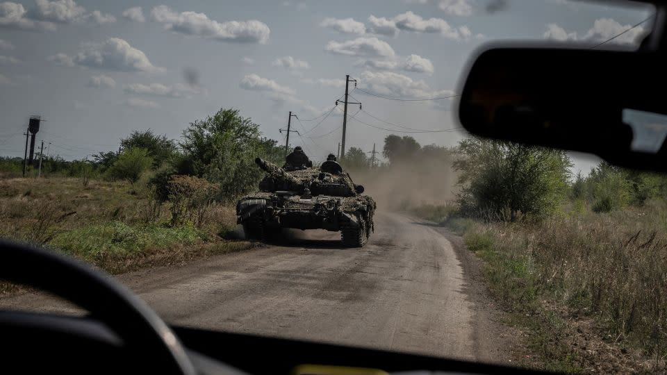 Ukrainian soldiers ride a tank near Robotyne,  a village that Kyiv took last week amid a slow and grueling counteroffensive against dense Russian defense lines.   - Viacheslav Ratynskyi/Reuters