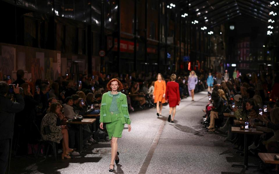 Models walk the street-turned-runway