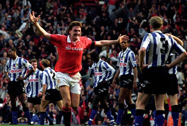 Steve Bruce celebrates scoring for Manchester United against Sheffield Wednesday