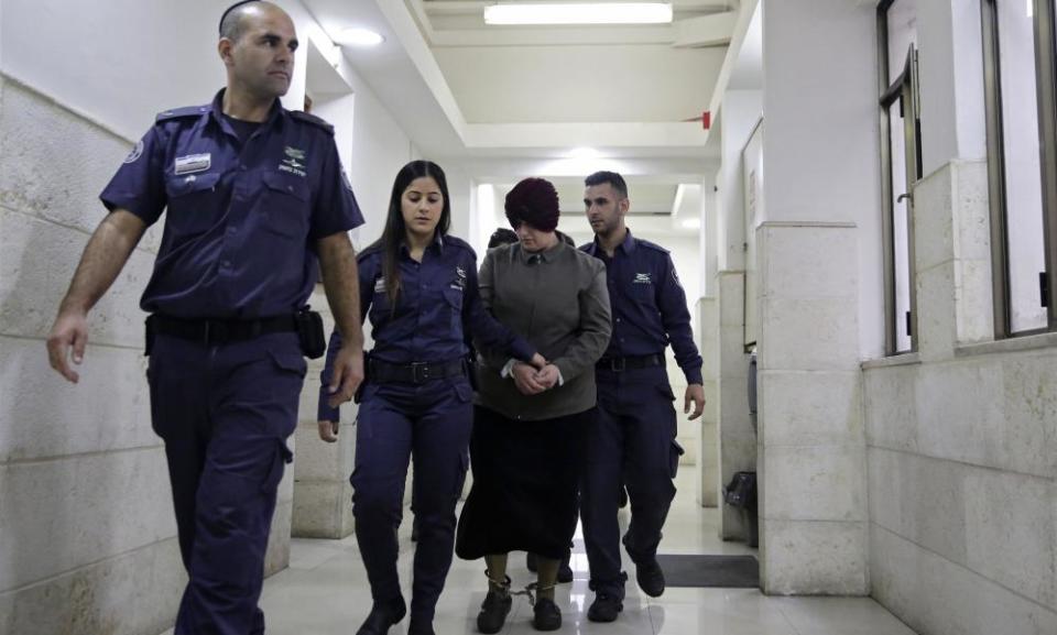 Malka Leifer, centre, is brought to a courtroom in Jerusalem.