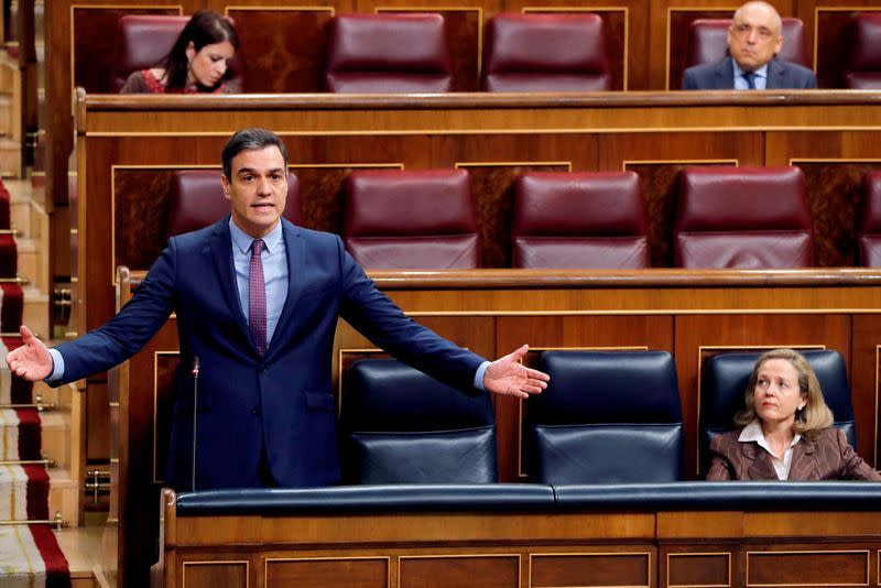 FILE PHOTO: Spanish PM Sanchez answers questions during a control session on coronavirus disease (COVID-19) at the Parliament in Madrid