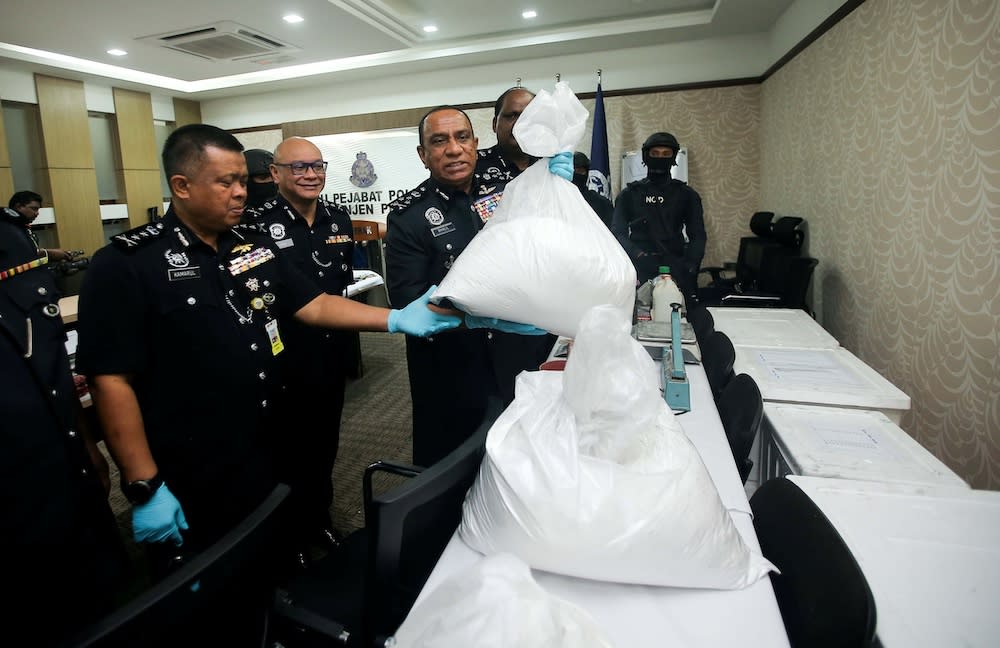 Bukit Aman Narcotics Crime Investigation Department (NCID) director Commissioner Datuk Mohd Khalil Kader Mohd showing the seized drugs at the Perak Police Headquarters in Ipoh, November 25, 2019. — Picture by Farhan Najib