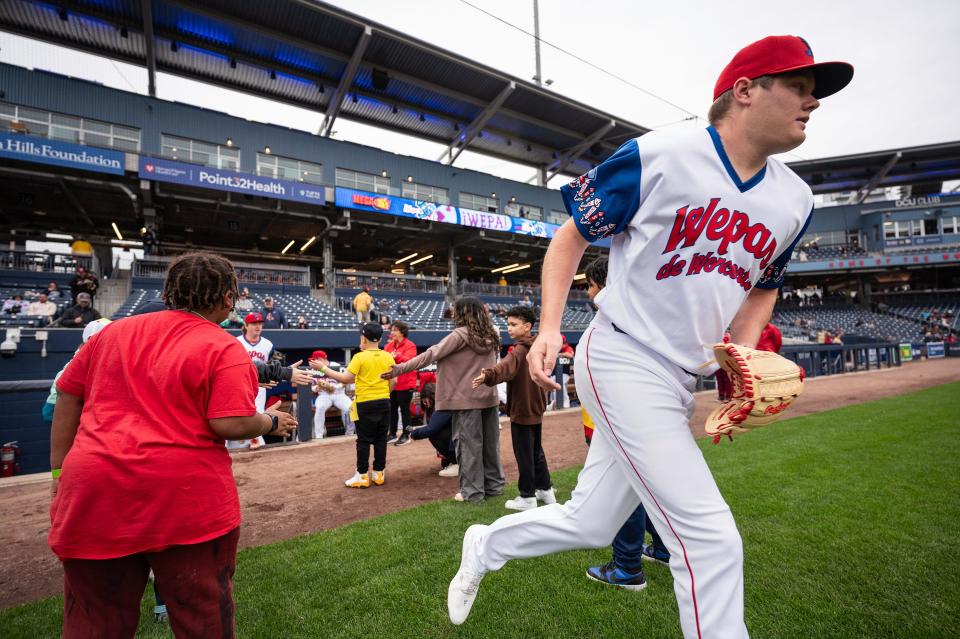 WooSox pitcher Richard Fitts takes charges onto the field to face the Lehigh Valley IronPigs.