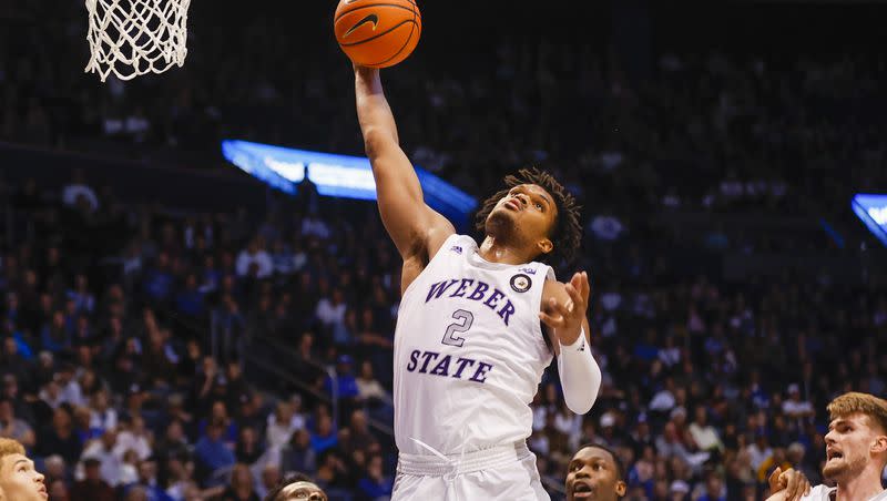Weber State Wildcats forward Dillon Jones jumps for a rebound while playing the BYU Cougars in Provo on Thursday, Dec. 22, 2022. BYU won 63-57.